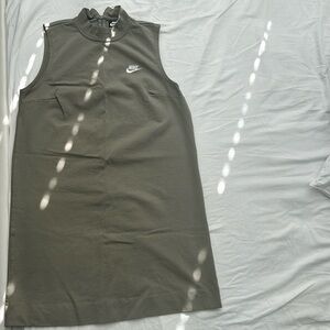 This is an olive green Nike high-neck dress.
